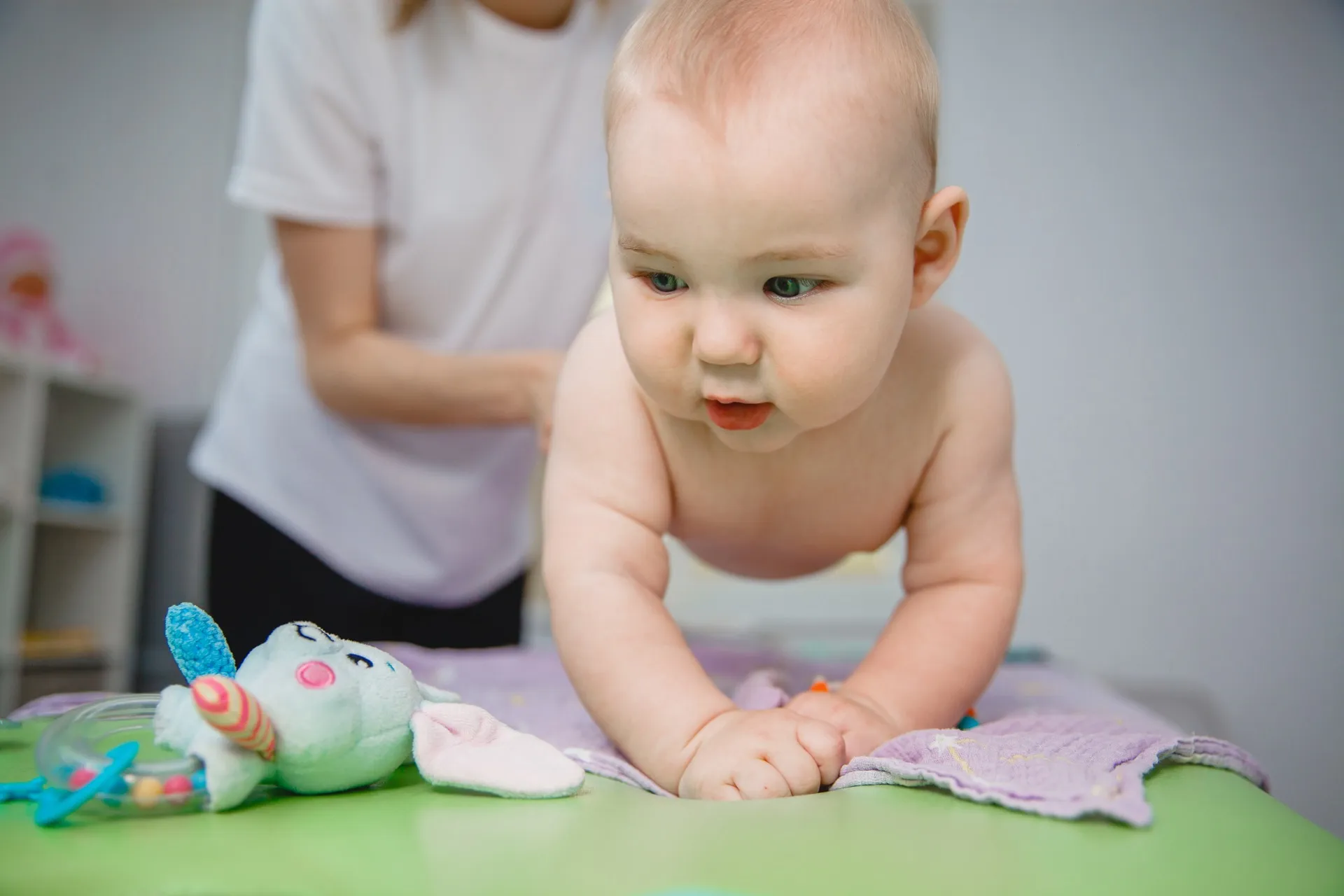 Baby during tummy time with toy